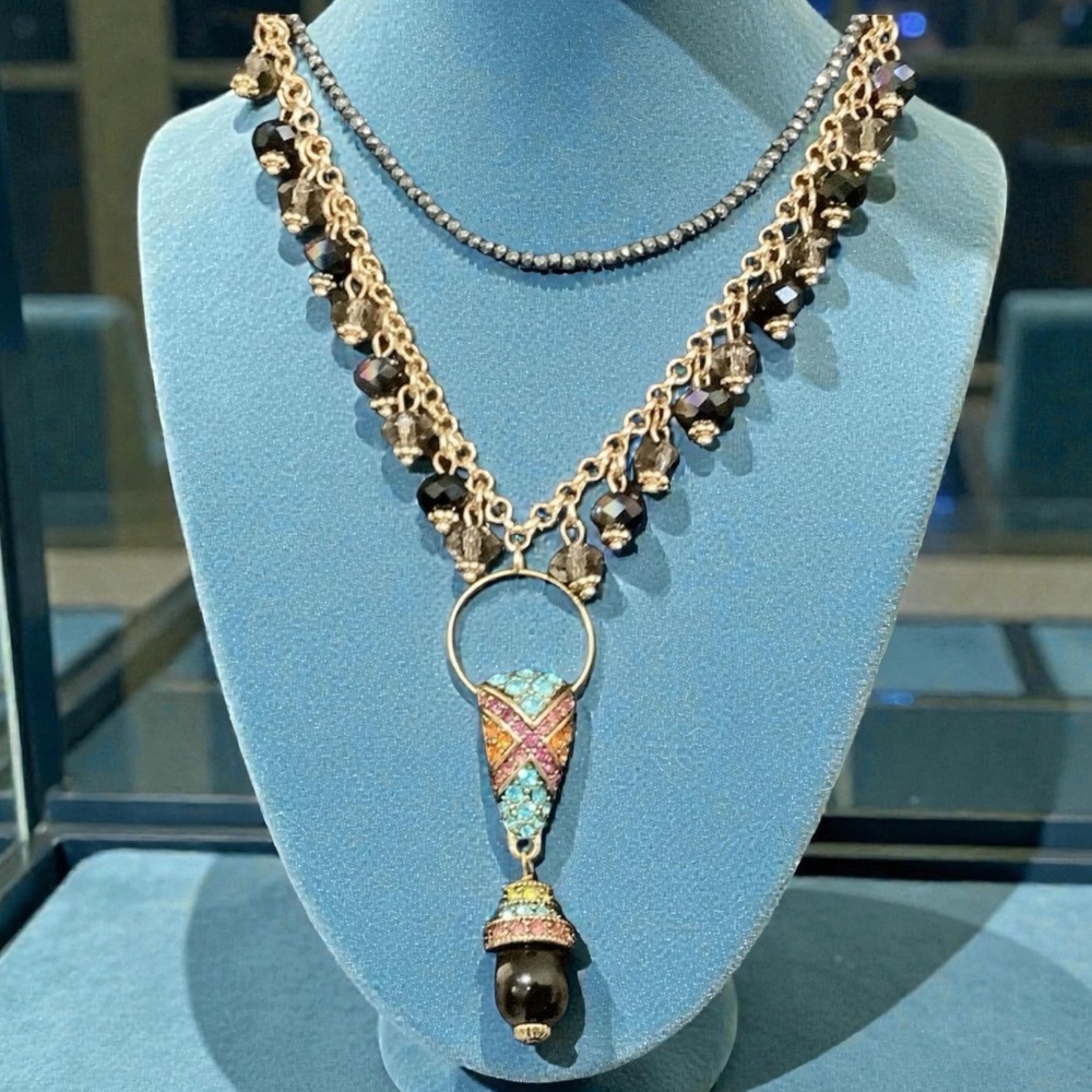 Heidi Daus art deco crystal pendant on a black & gold iridescent necklace